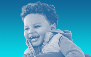 Image of a male toddler smiling
