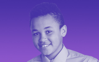 secondary-kid-1 Image of a teenage boy smiling